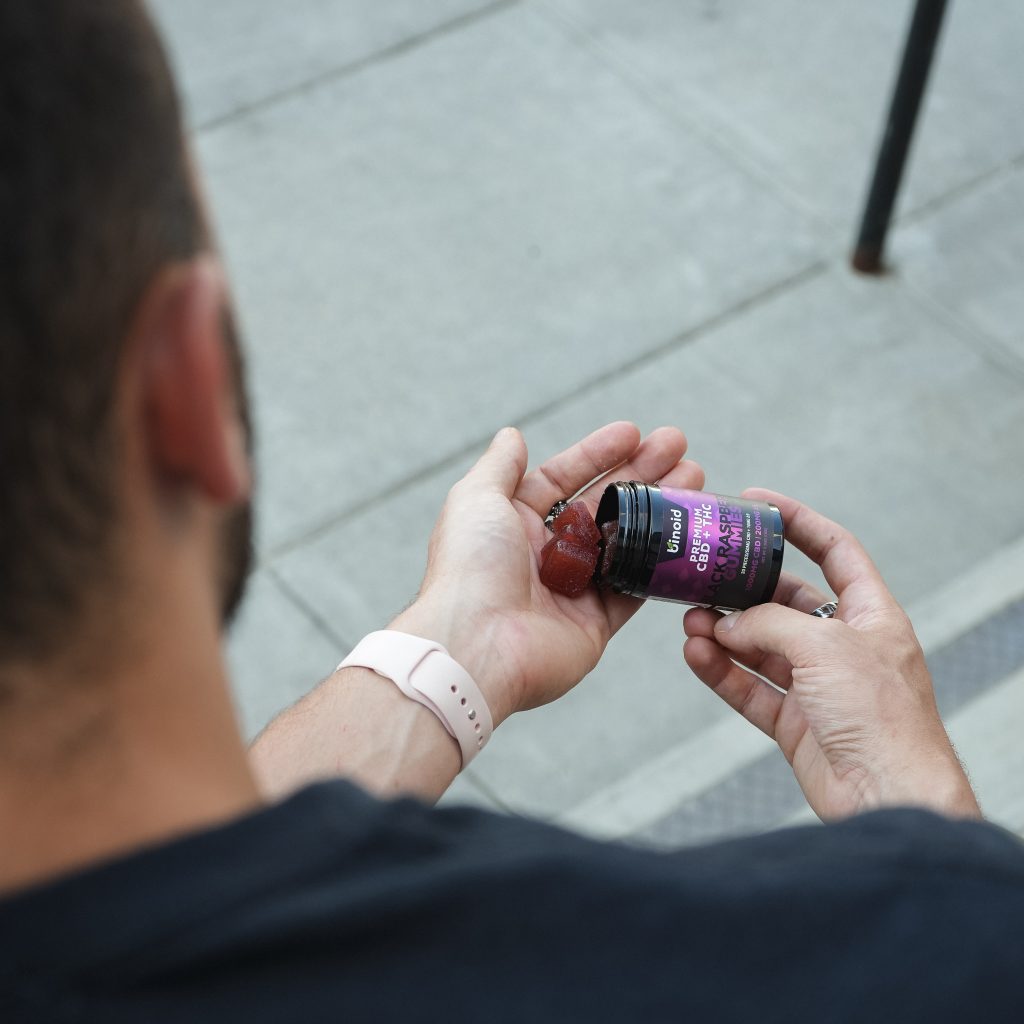 man pouring delta 9 cannabinoid blends from binoid