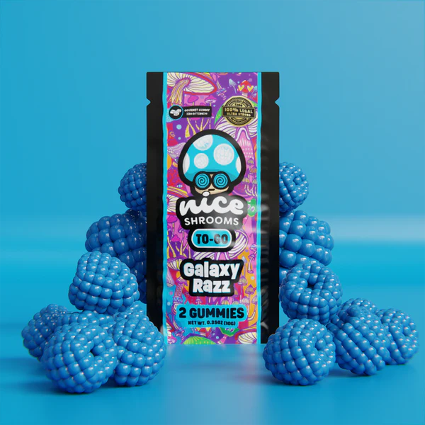Image showing the best mushroom edibles in the form of a mushroom gummy in front of a blue background.