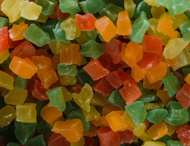 Pile of gummies showing the difference between cbd and amanita mushroom.