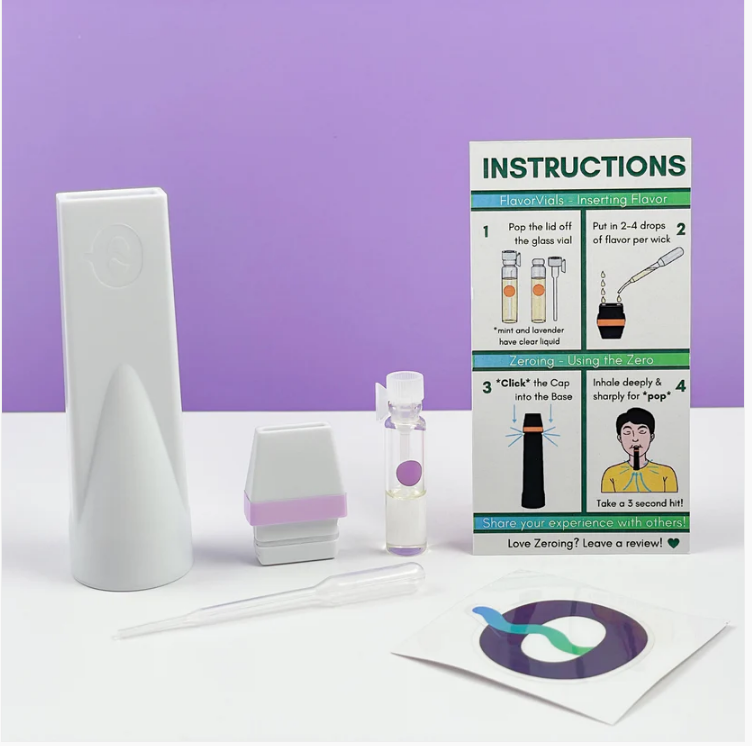 Image of CAPNOS pressurized air inhalers shown in front of violet background showing zeroing benefits.