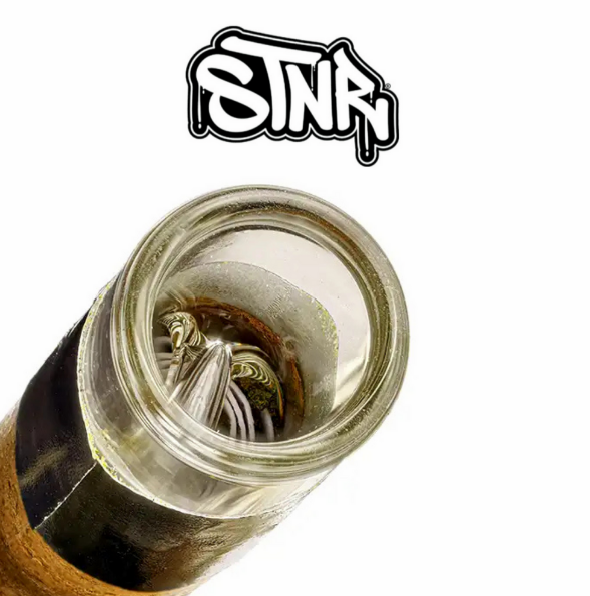 Glass tip blunts by STNR Creations displayed in front of eyecatching background.