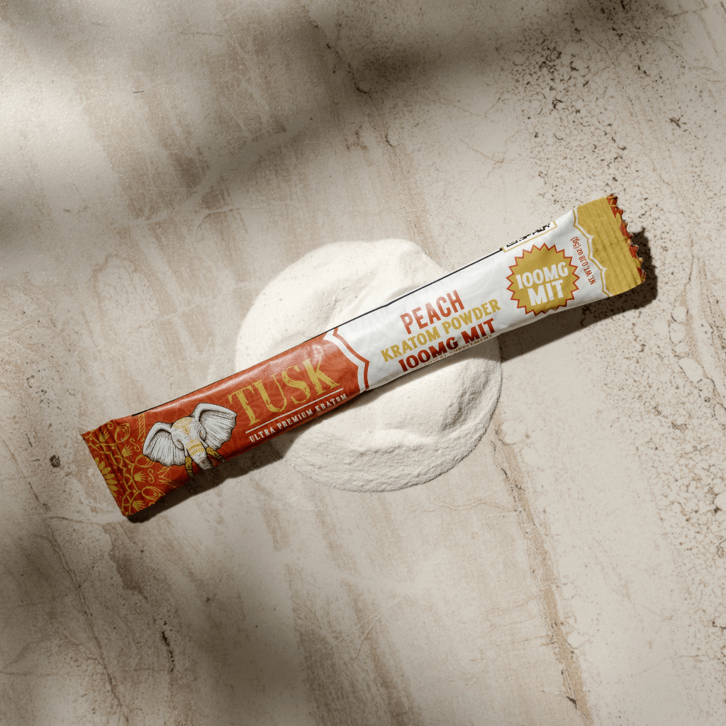 Tusk Kratom Extract Powder Packets displayed on a colorful background.