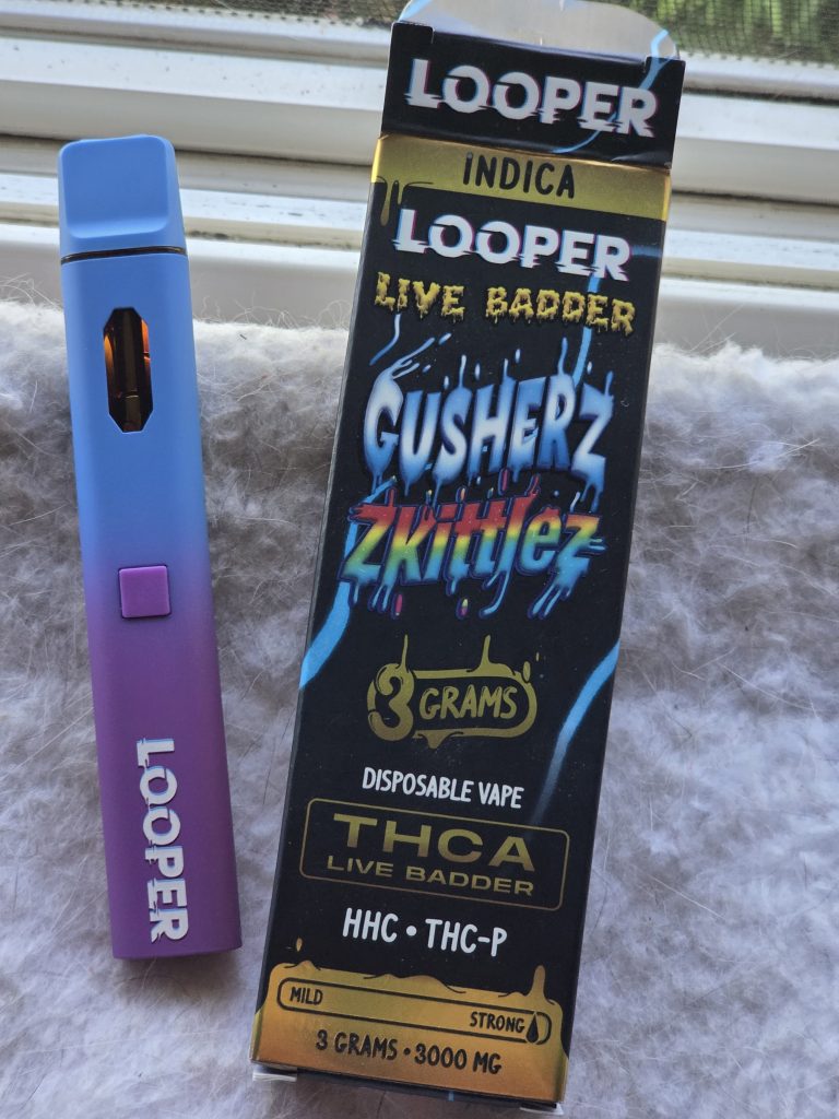 Looper Live Badder 3G Disposable Vape displayed in front of a colorful background.