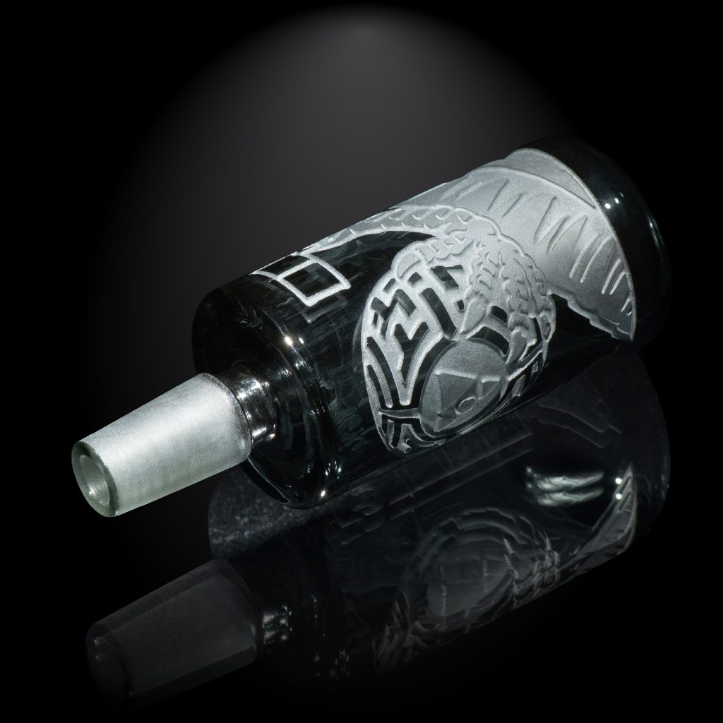 best bong bowls displayed in front of a dark background with reflection on the floor.