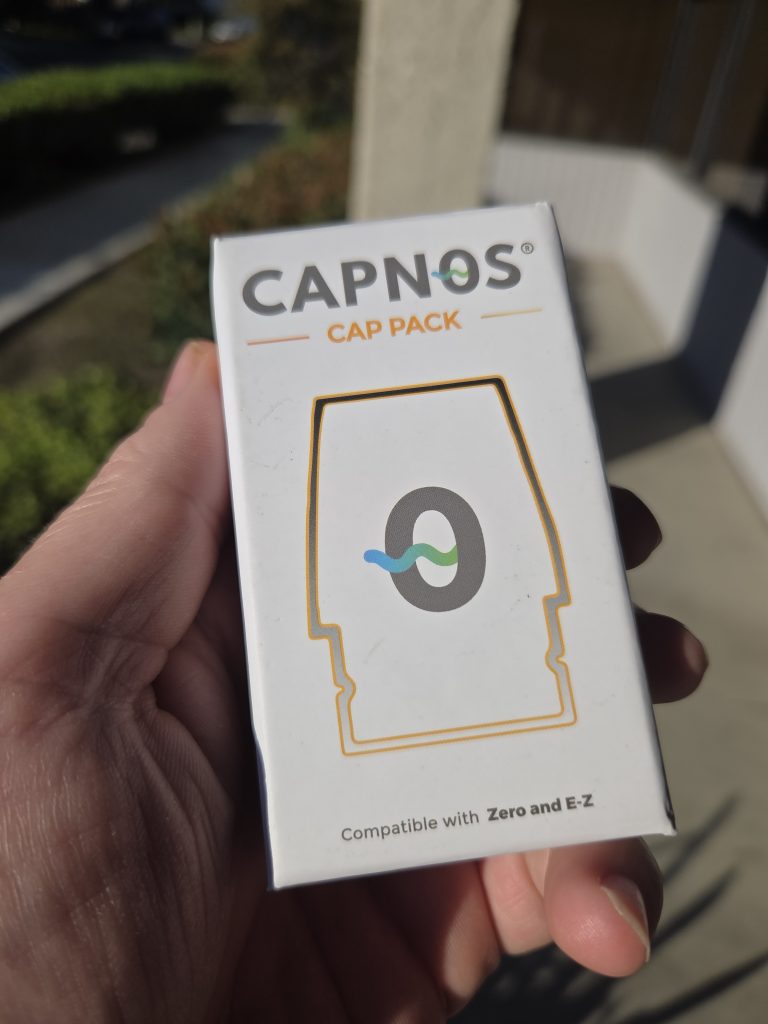 CAPNOS The Cap Pack – Tropical Fruit Flavored displayed in front of a colorful background.