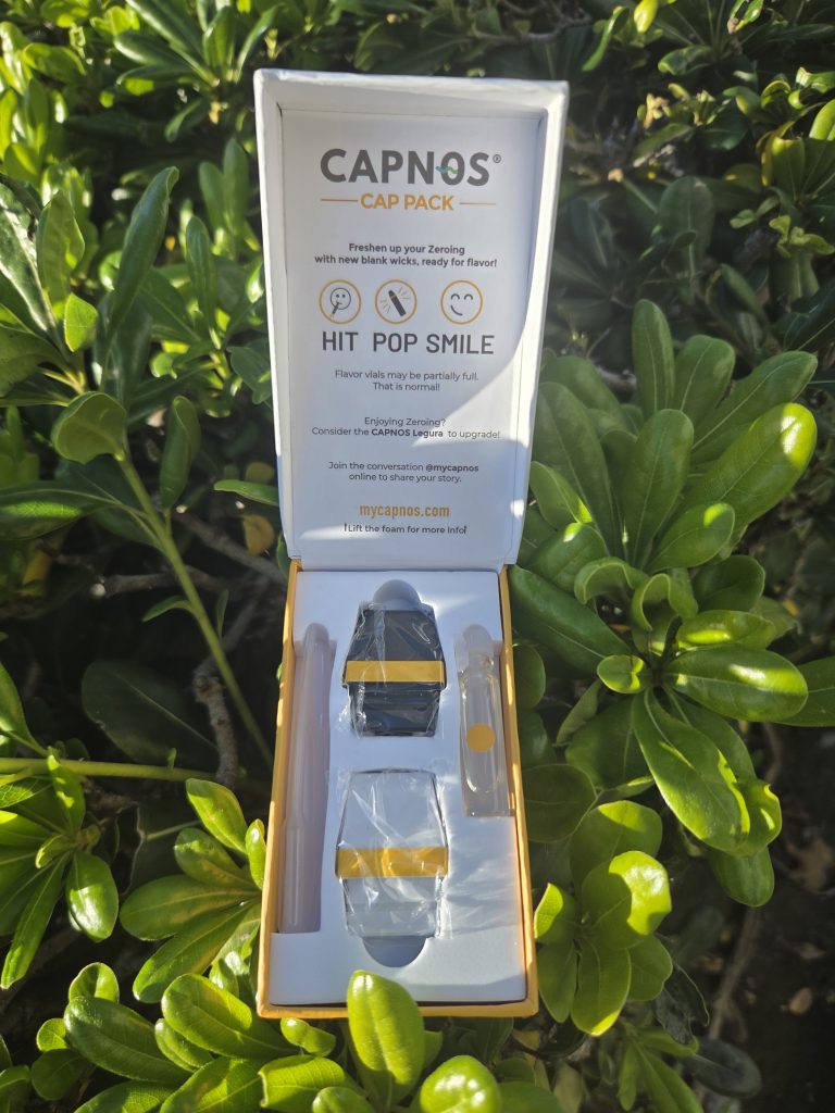 CAPNOS The Cap Pack – Tropical Fruit Flavored displayed in front of a colorful background.