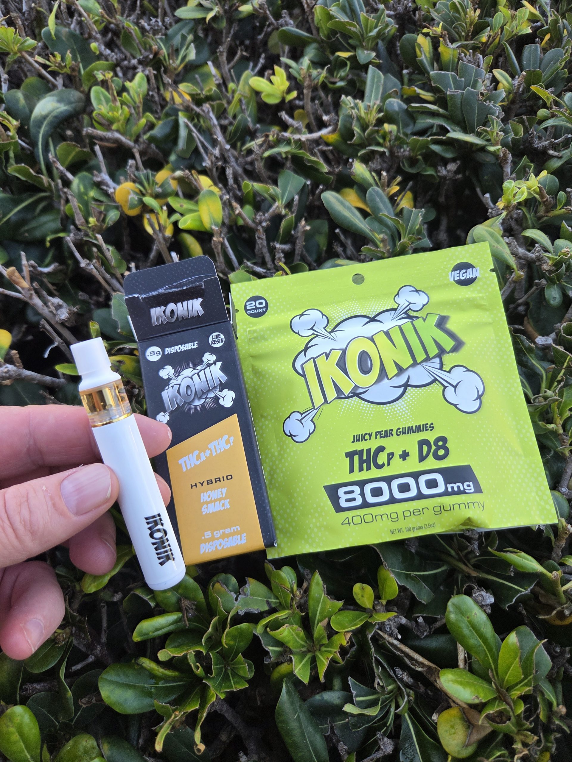 Wild Orchard Co. IKONIK shown in front of a green background being held.