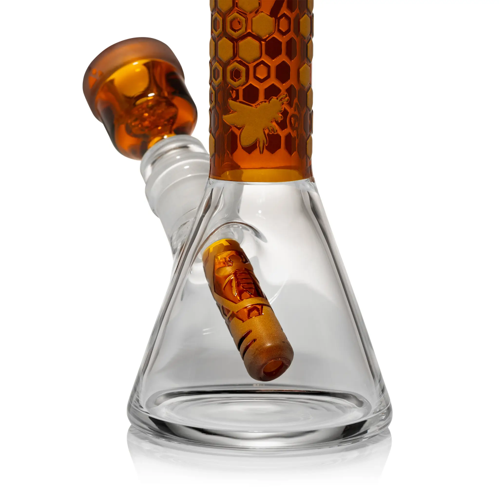 One of the best glass beaker bongs offered by Milkyway Glass in orange touch displayed in front of white background.