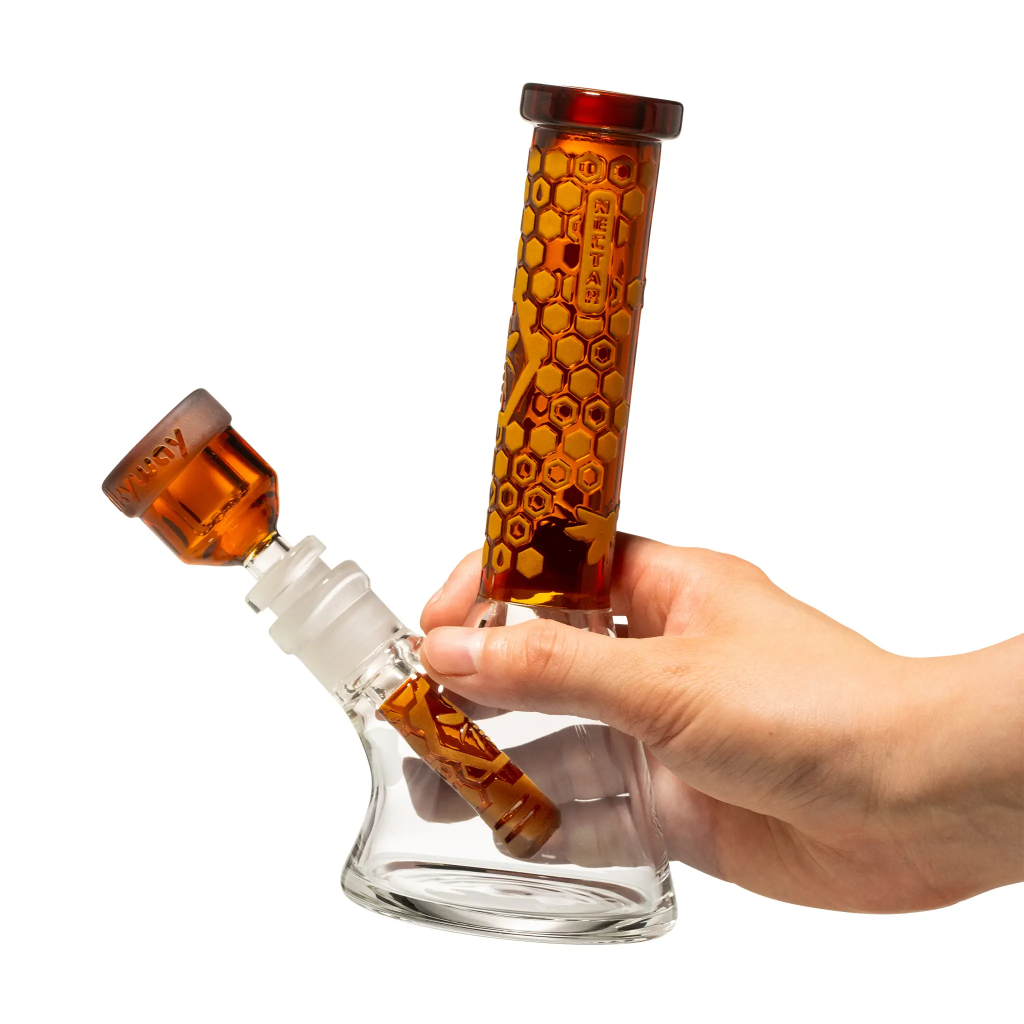 One of the best glass beaker bongs offered by Milkyway Glass in orange touch displayed in front of white background.