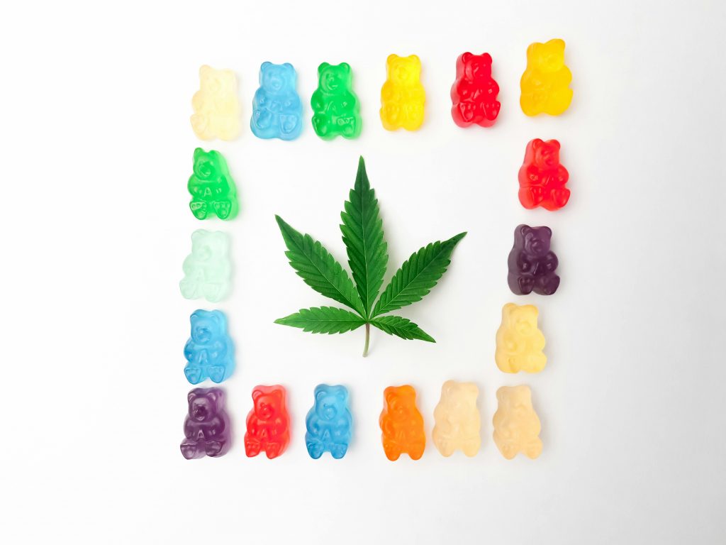 Delta 9 CBD Gummies in the shape of bear gummies displayed on a floor.