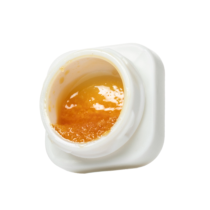 THCA badder displayed in front of a white background inside of a binoid packaging.