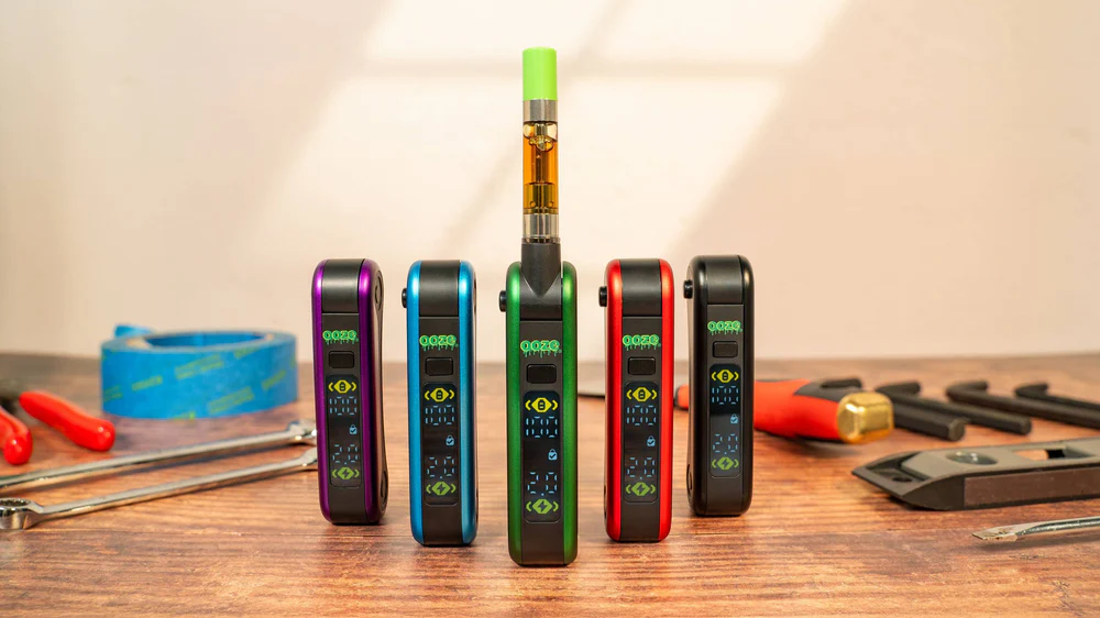 Ooze Hinge Flick Battery – 210 mAh - Black  products displayed above a wooden table showing the different colors available.