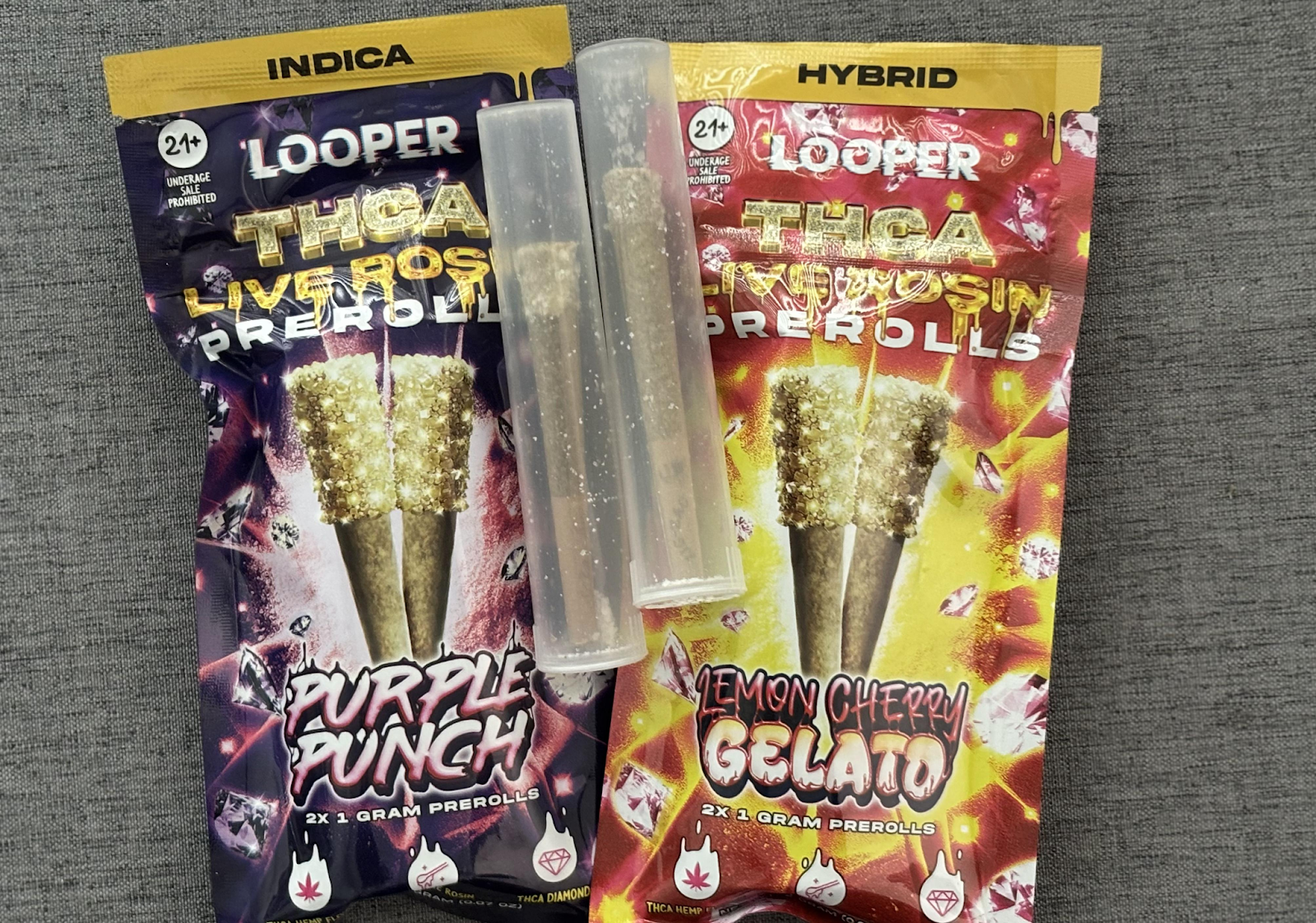 Looper THCA Live Rosin Prerolls displayed side by side on top of a table.