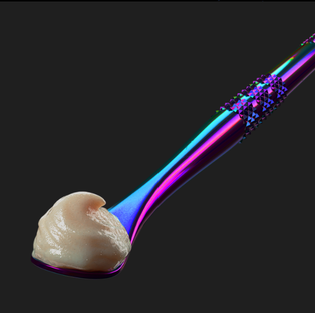 THCA live badder dabz from Looper displayed showing a drop of it on a chrome blue and violet stick spoon.
