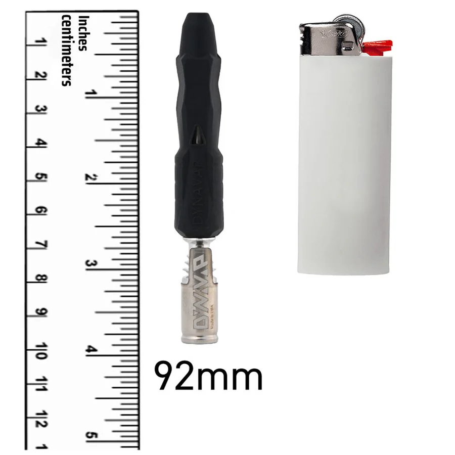Dynavap The B2 displayed on top of a white floor and in front of a white background compared to a ruler and a torch lighter.