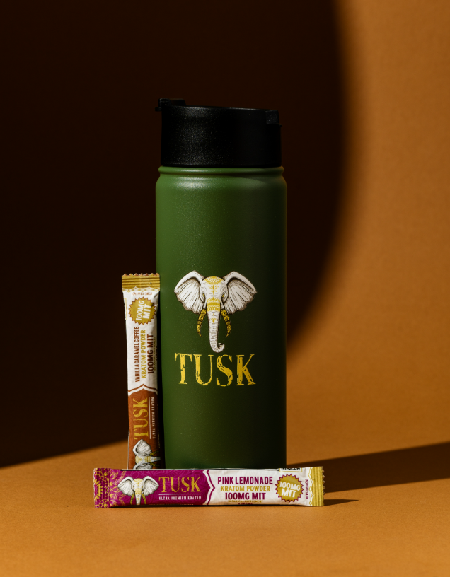 Kratom vs CBD shown by a Tusk Kratom product placed in front of a brown and orange background with two packets of Tusk Kratom powder.