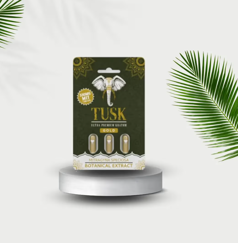 Kratom and Caffeine mixture being prepared while showing a Tusk Kratom product in front of a white background with kratom leaves beside it.