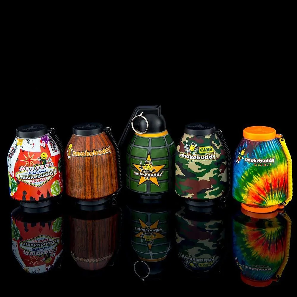 Best odor eliminator for smoke: Smokebuddy devices, displayed in front of a dark, black background with reflections on the ground.
