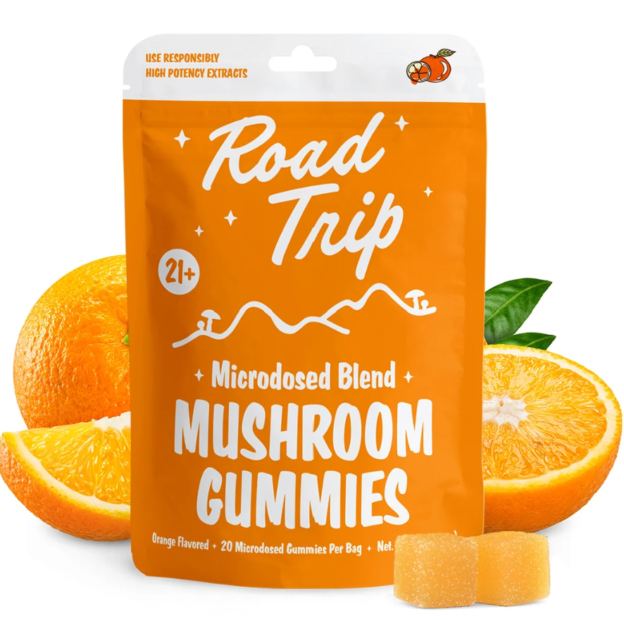 Microdosed gummies in orange blend shown in front of a white background with oranges and the packet.
