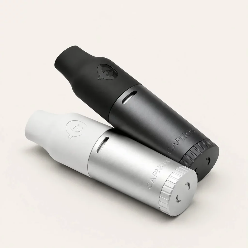 Two best vape replacement devices on the floor displayed in front of a white background.